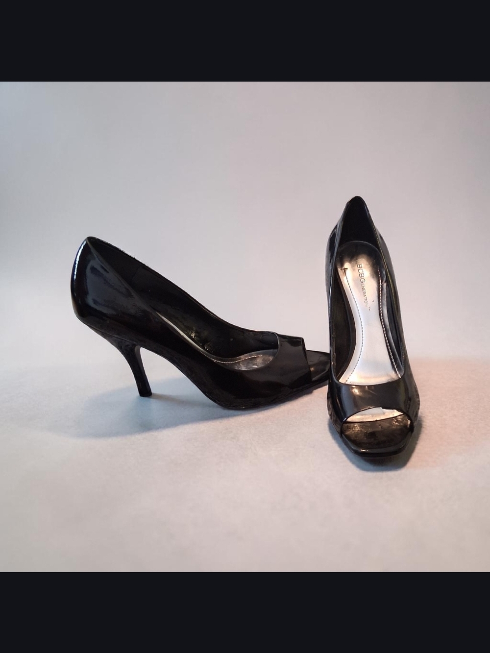black patent peep-toe pumps from BCBGeneration Womens Stiletto Heels Size 8